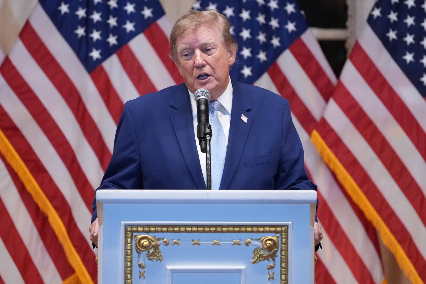 Trump puts new Russia sanctions that he recently signed into law on hold , citing national interest