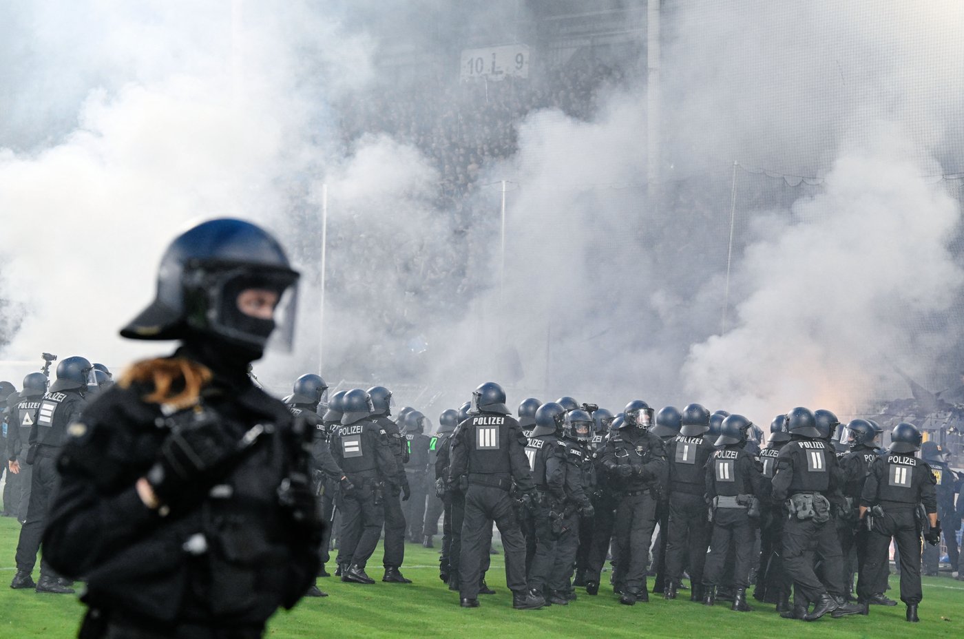 German Cup match marred by fireworks, pitch invasion | iNFOnews.ca