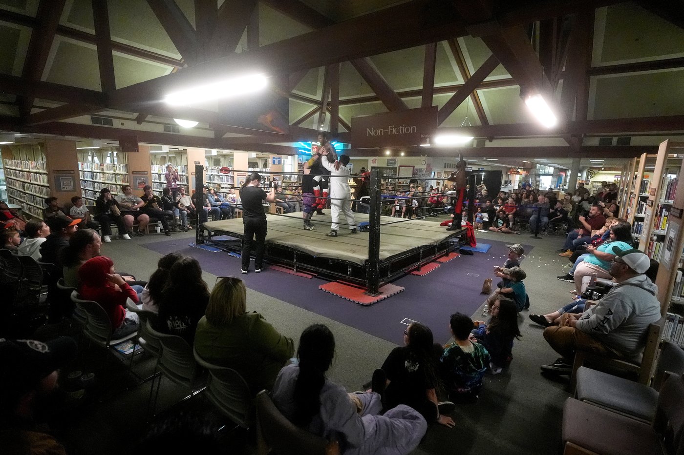 Wrestling matches provide an action-packed story time at US libraries, in photos | iNFOnews.ca
