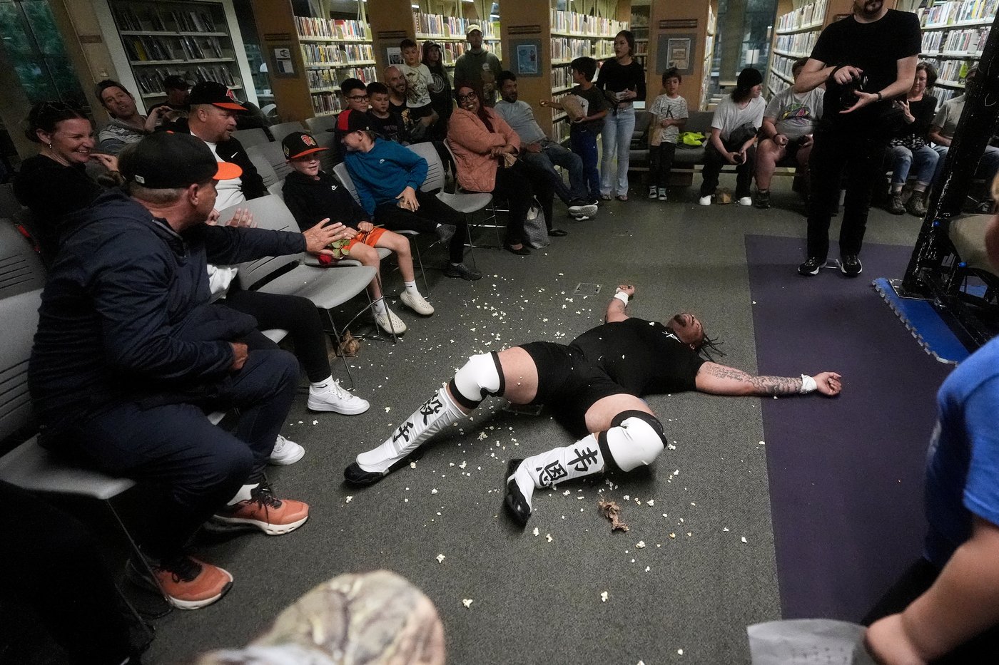 Wrestling matches provide an action-packed story time at US libraries, in photos | iNFOnews.ca