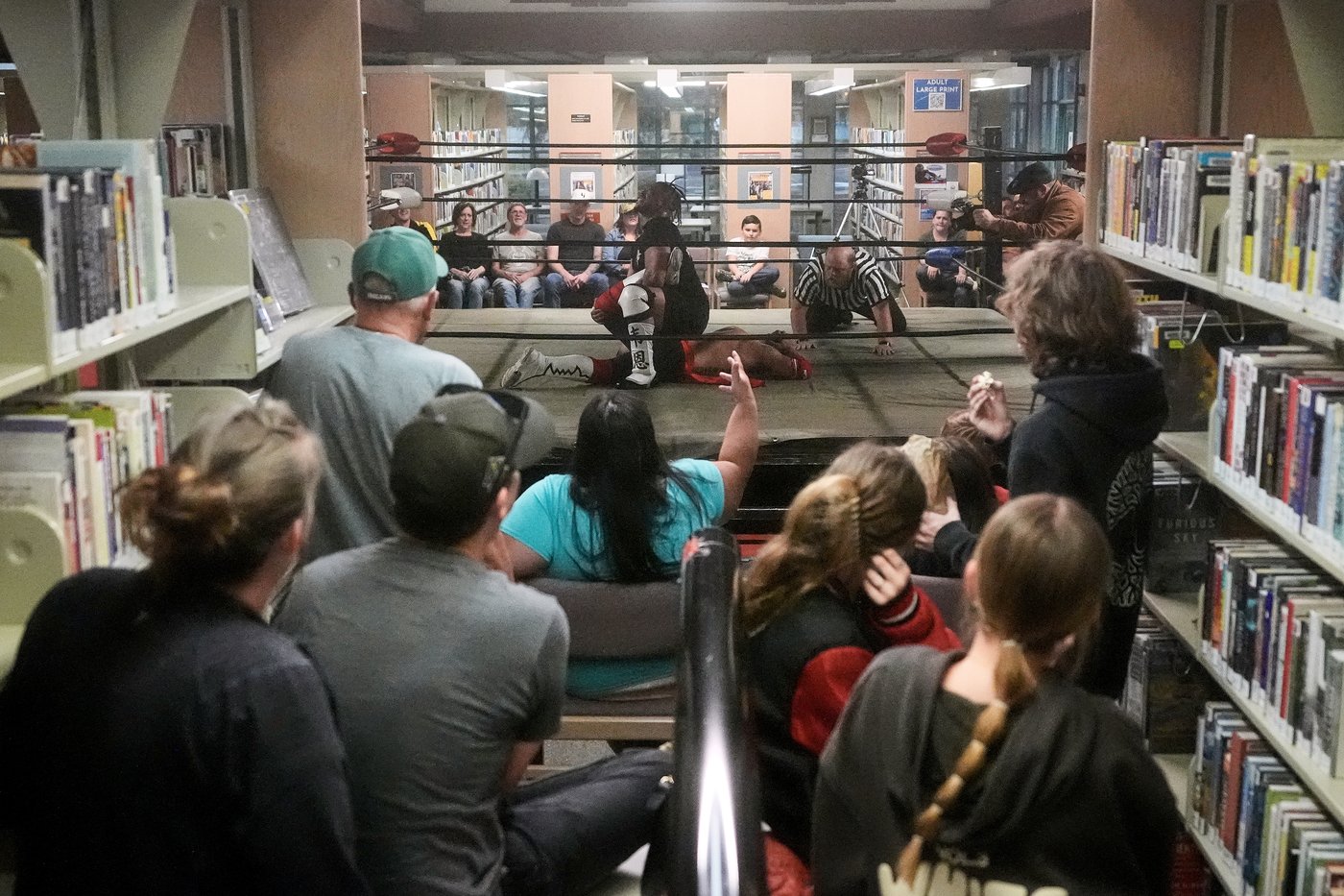 Wrestling matches provide an action-packed story time at US libraries, in photos | iNFOnews.ca