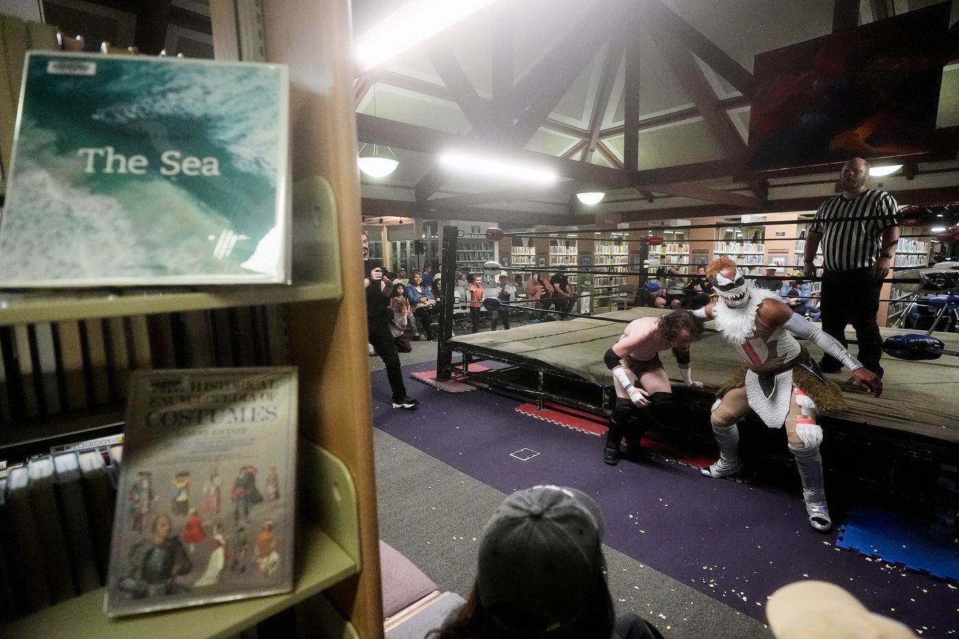 Wrestling matches provide an action-packed story time at US libraries, in photos | iNFOnews.ca