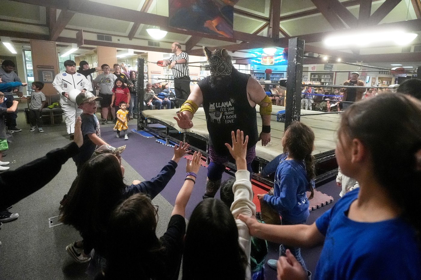 Wrestling matches provide an action-packed story time at US libraries, in photos | iNFOnews.ca