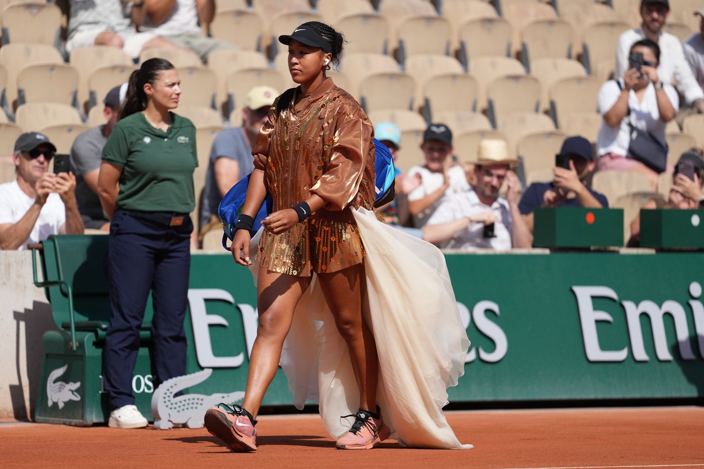 Naomi Osaka's latest French Open fashion ensemble includes an ivory train and gold jacket | iNFOnews.ca