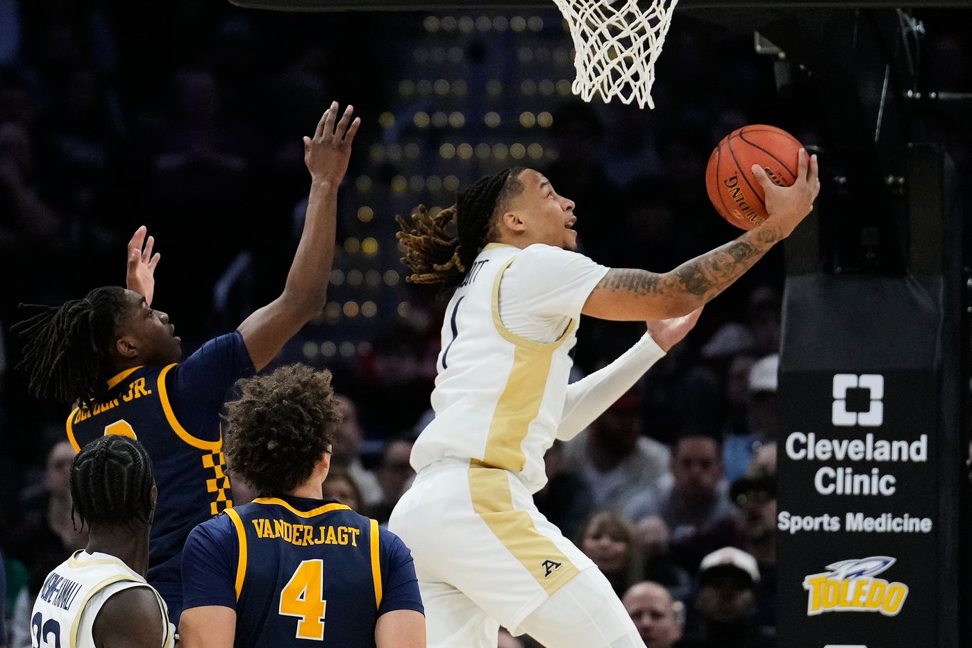 Scott's deep 3-point bomb sends Akron past Toledo, 79-76 for 3rd straight MAC crown | iNFOnews.ca Scott's deep 3-point bomb sends Akron past Toledo, 79-76 for 3rd straight MAC crown | iNFOnews.ca