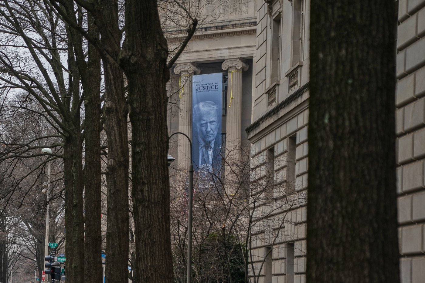 Large banner featuring Trump's face is displayed on Justice Department headquarters | iNFOnews.ca
