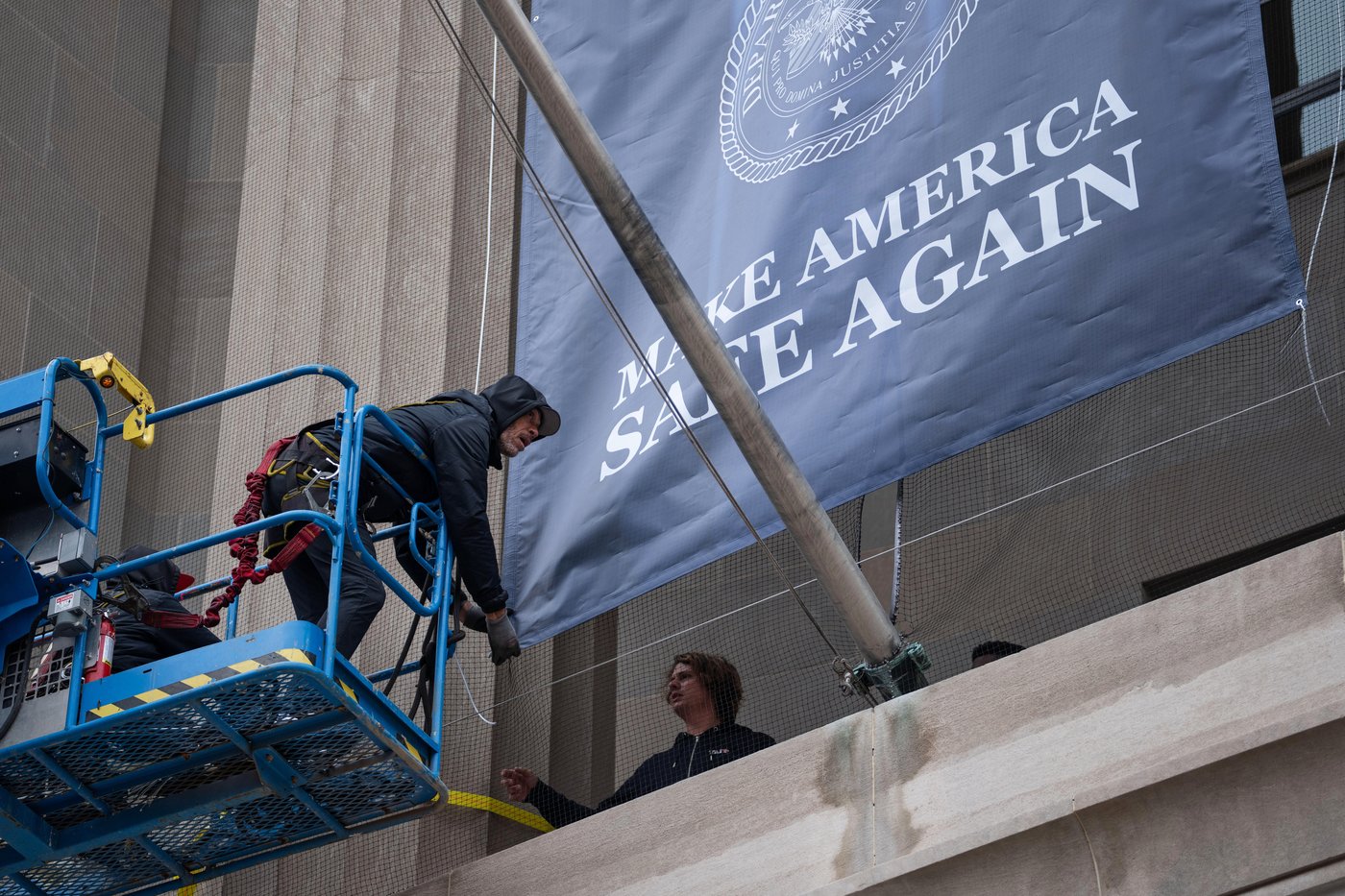 Large banner featuring Trump's face is displayed on Justice Department headquarters | iNFOnews.ca