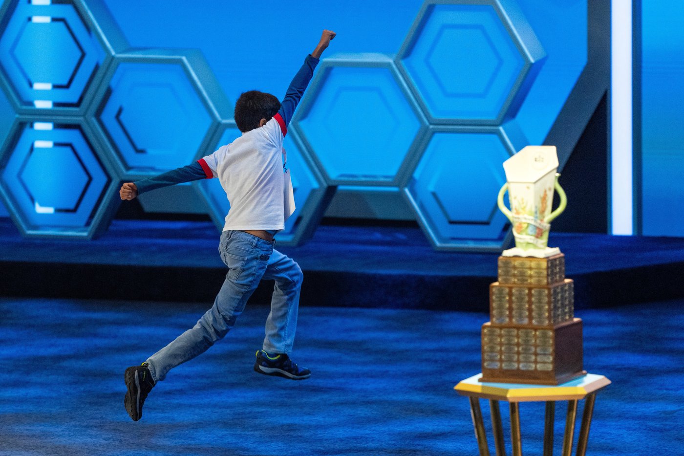 Photos of students competing for the Scripps National Spelling Bee trophy | iNFOnews.ca