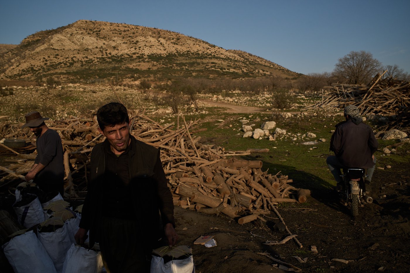 Photos: Charcoal workers in a quiet Kurdish village carry on as war unfolds | iNFOnews.ca