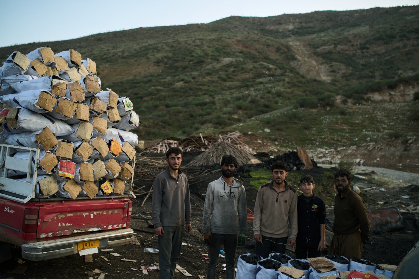 Photos: Charcoal workers in a quiet Kurdish village carry on as war unfolds | iNFOnews.ca