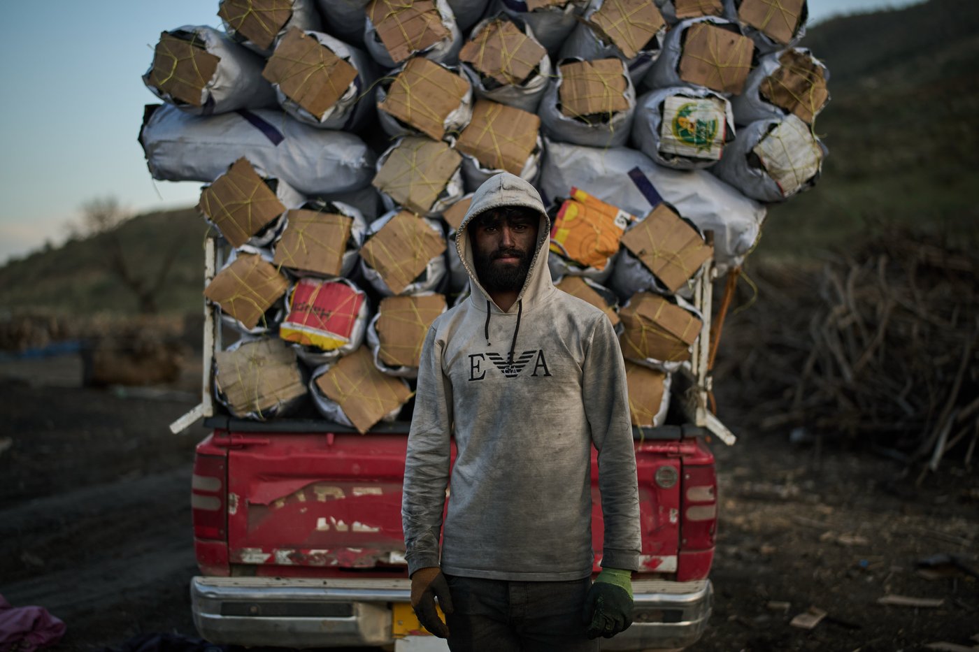 Photos: Charcoal workers in a quiet Kurdish village carry on as war unfolds | iNFOnews.ca