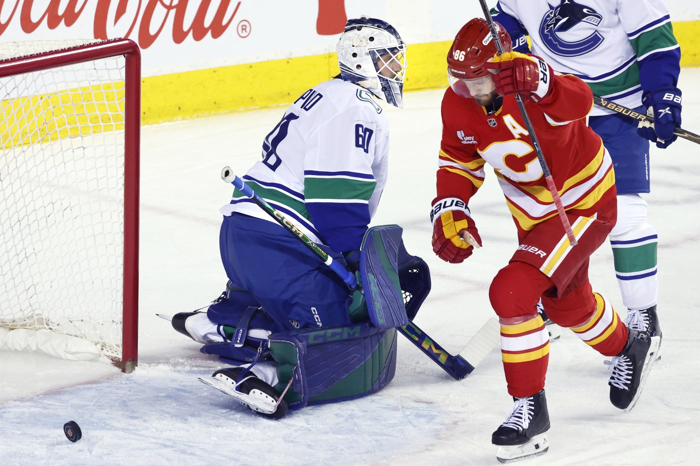 Flames ignite their offence, burn Canucks 7-3 | iNFOnews.ca