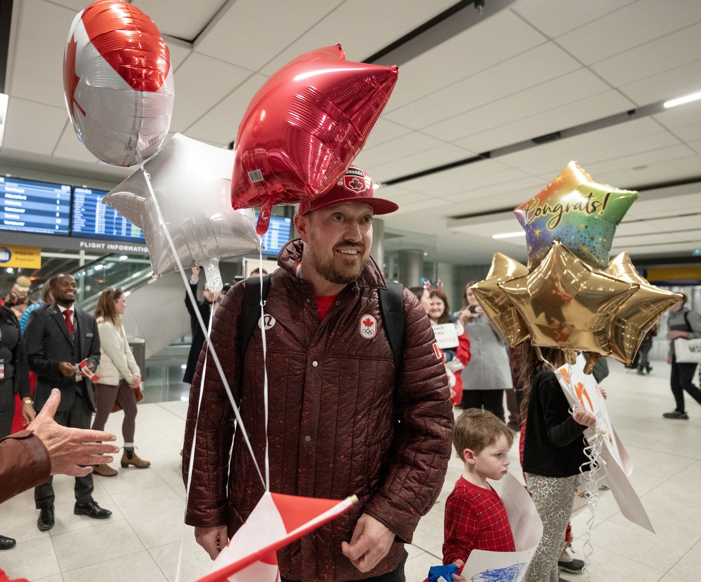 Photo Gallery: Canada's Olympians arrive home | iNFOnews.ca