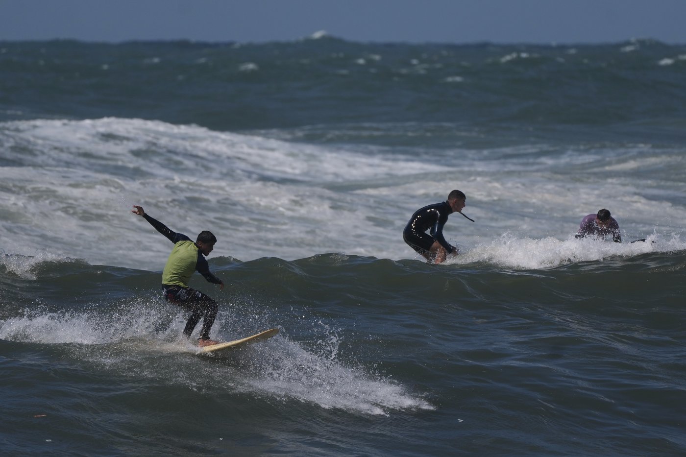 Surfers in war-torn Gaza find rare moments of joy taking to the waves | iNFOnews.ca
