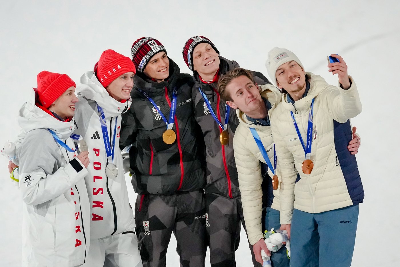 Austria wins gold in 1st Olympic men's super team ski jump as event | iNFOnews.ca
