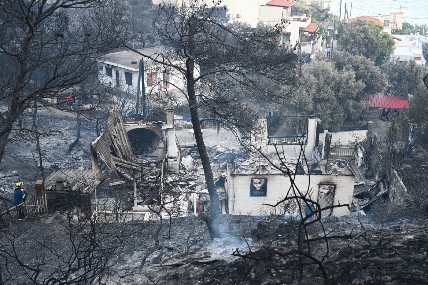 Firefighters battle wildfires in Belgium and Greece as 2 die on an island near Athens | iNFOnews.ca