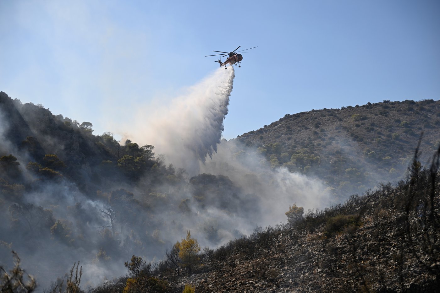 Firefighters battle wildfires in Belgium and Greece as 2 die on an island near Athens | iNFOnews.ca