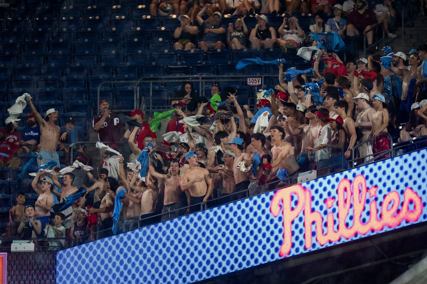 Shirtless fans the stars at MLB stadiums as 'Tarps Off' trend sweeps baseball world | iNFOnews.ca