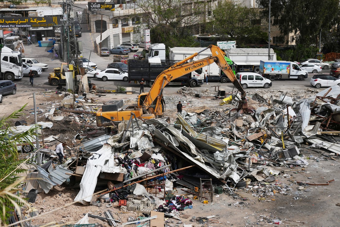 Israeli bulldozers raze about 50 Palestinian shops ahead of settlement-linked road project | iNhome