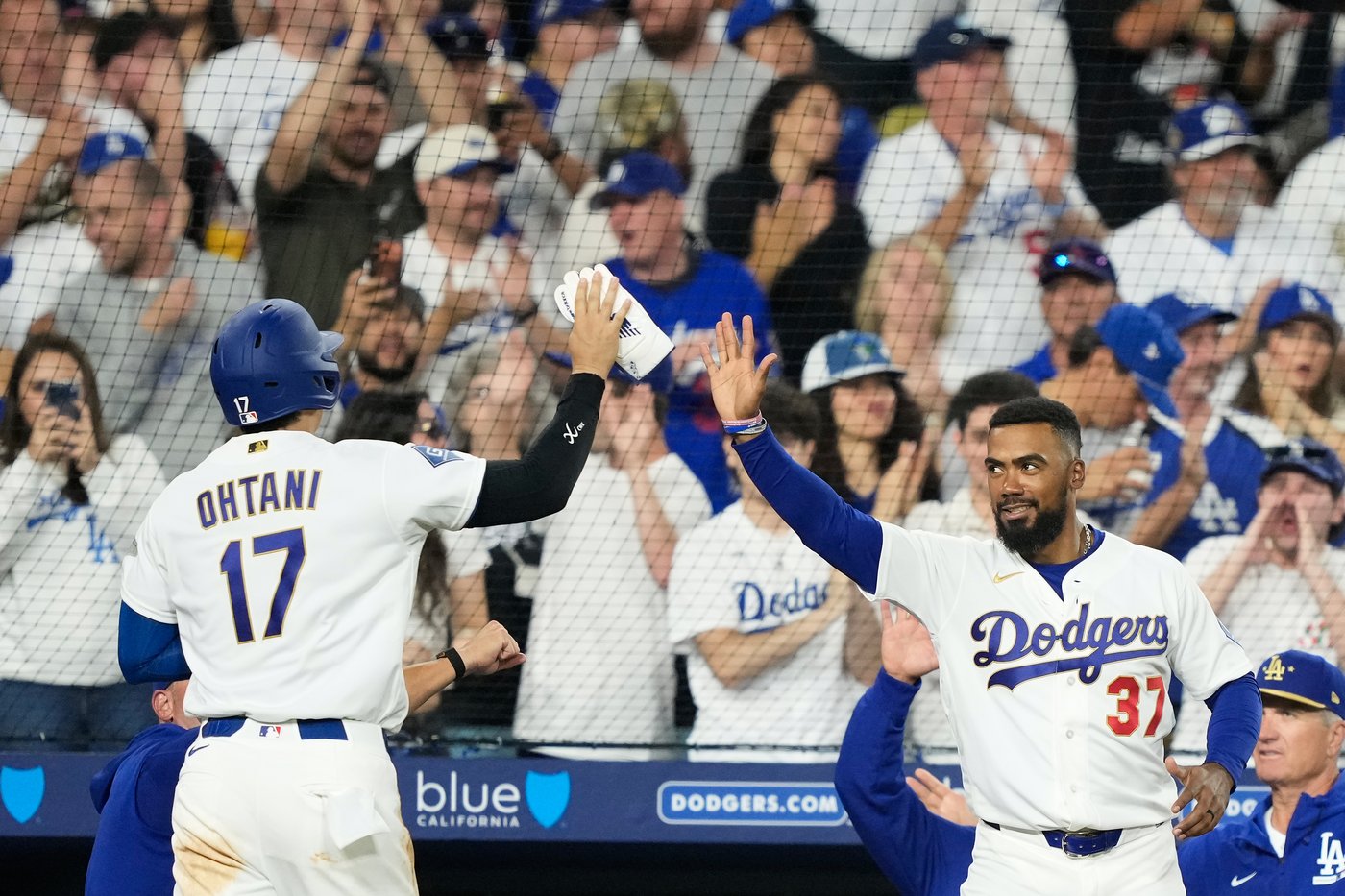 Dodgers open defense of back-to-back World Series titles with a win | iNFOnews.ca