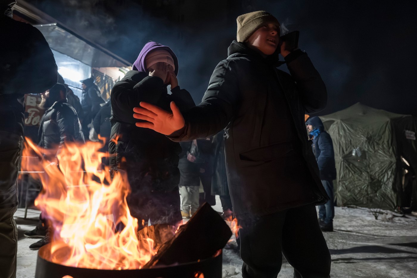 Photos show Ukrainians enduring a frigid winter after Russian strikes knocked out power | iNFOnews.ca