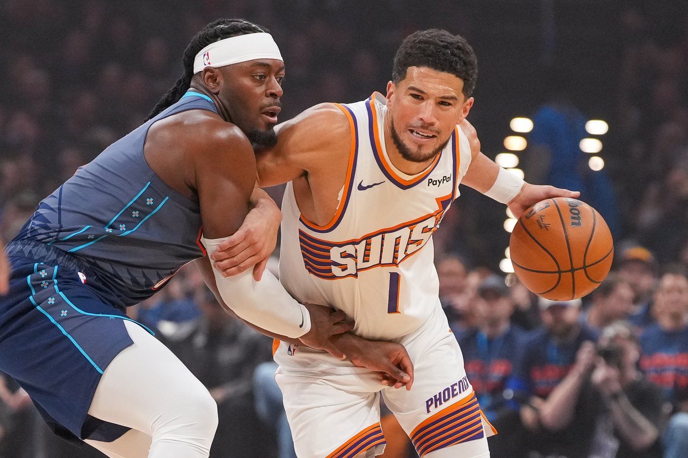 Suns' Booker hurts ankle after tripping over Dort's foot, says he doesn't know if it was on purpose | iNFOnews.ca