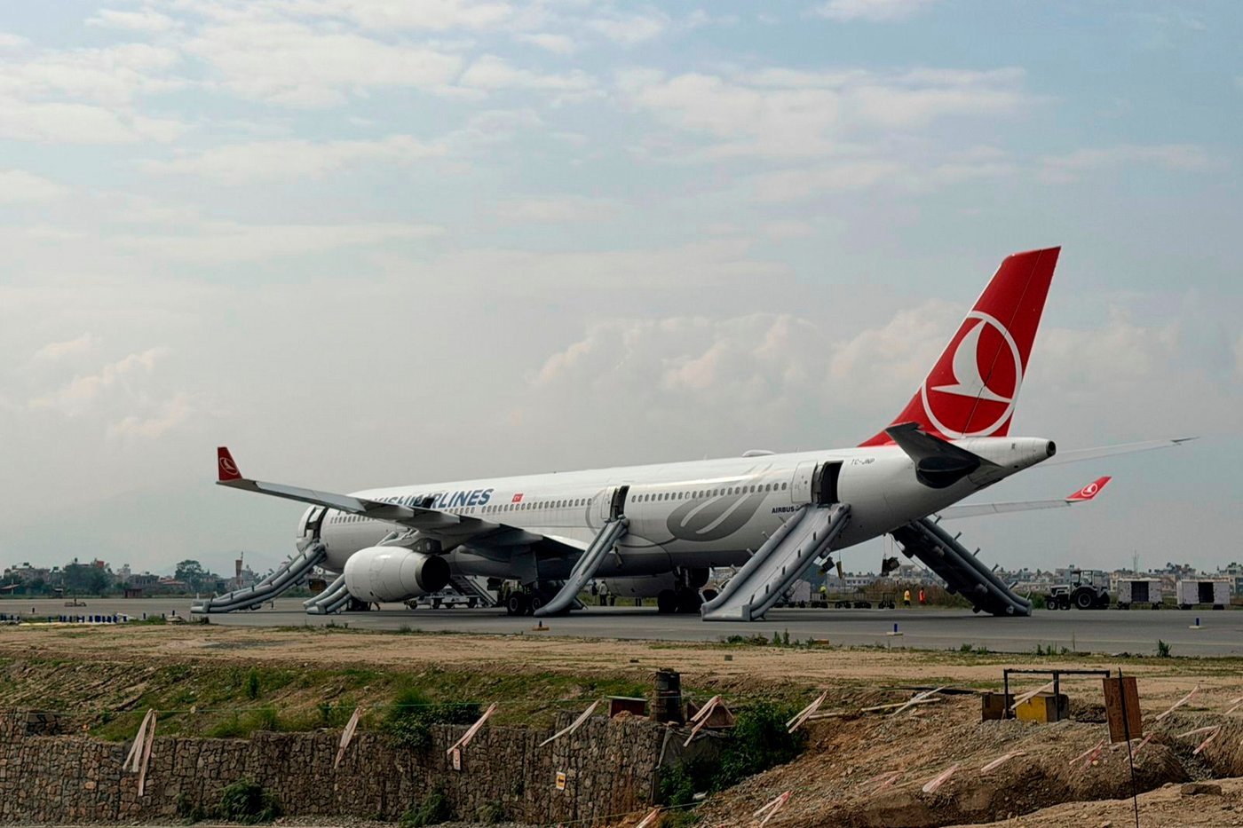 Turkish Airlines jet safely evacuated after landing gear smoke at Nepal airport | iNFOnews.ca