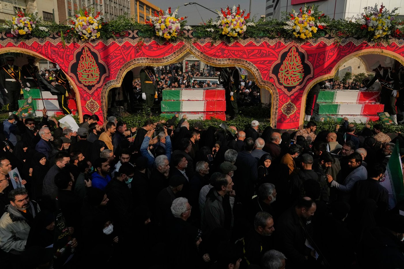 Photos show mourners in Tehran honoring the unknown soldiers killed in the 1980's Iran-Iraq war | iNFOnews.ca