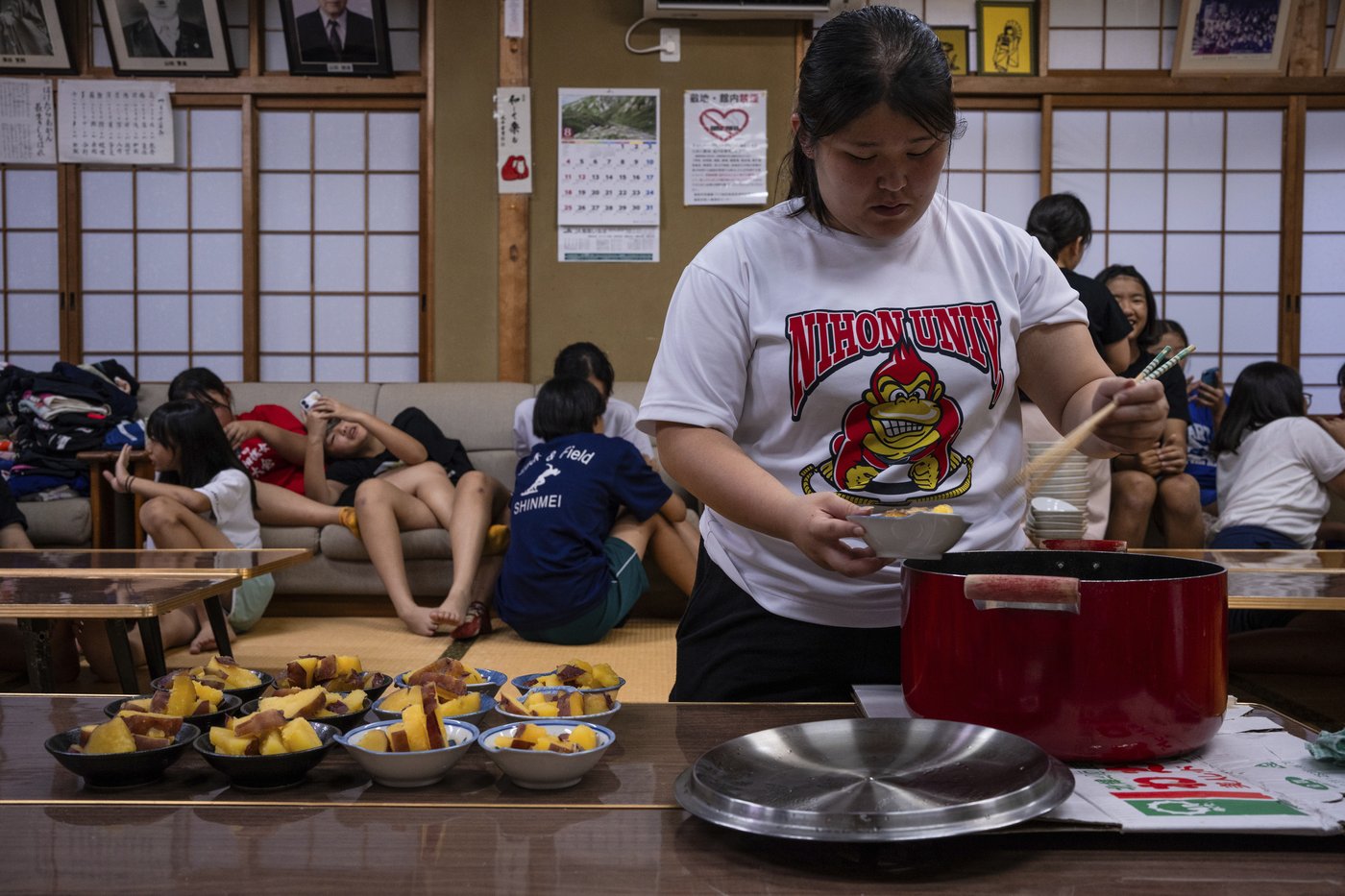 Photos show women in Japan working to break down barriers in ancient, tradition-bound sumo | iNFOnews.ca