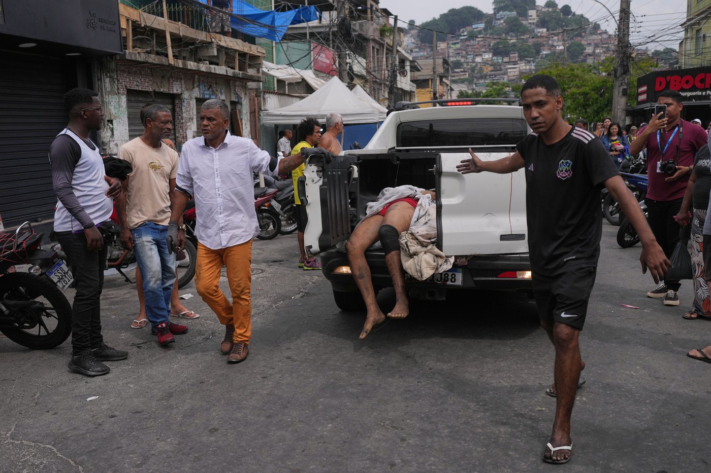 Anguish in Rio: Photos show bodies lining the streets after massive police raid | iNFOnews.ca