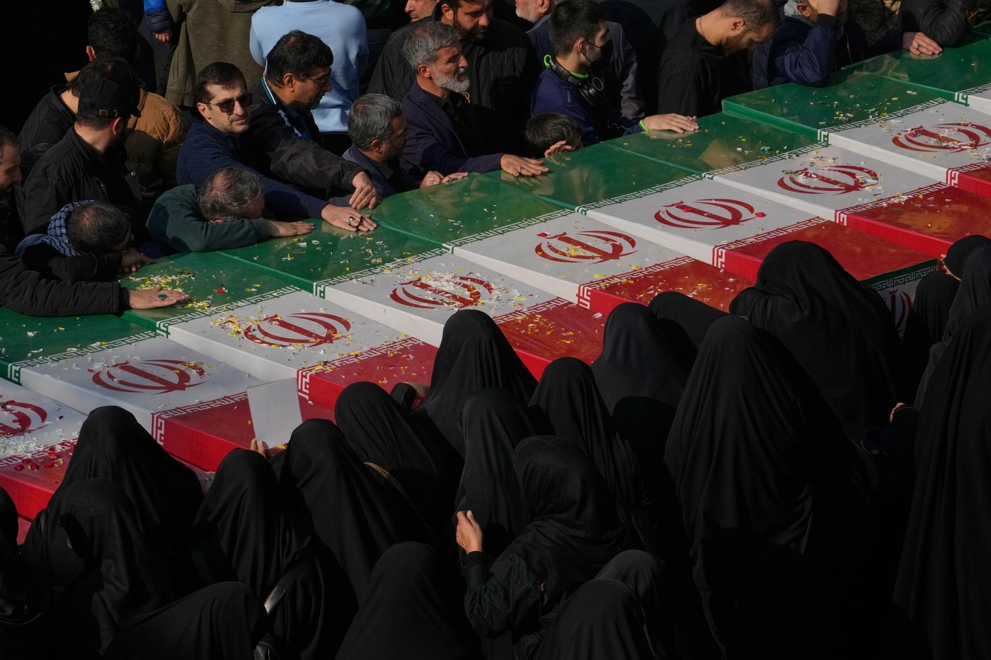 Photos show mourners in Tehran honoring the unknown soldiers killed in the 1980's Iran-Iraq war | iNFOnews.ca