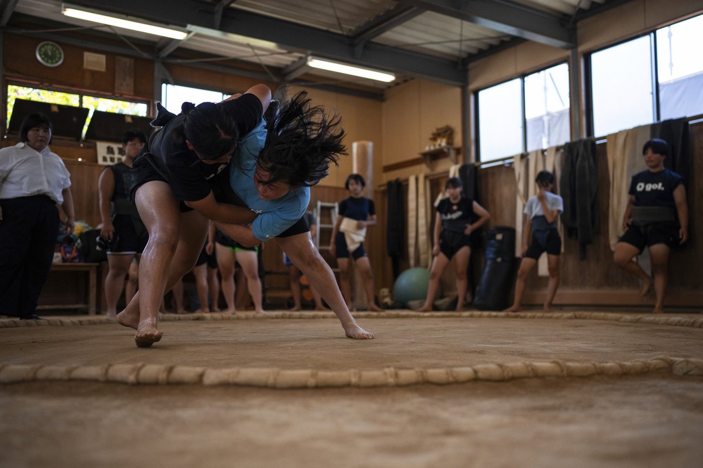 Photos show women in Japan working to break down barriers in ancient, tradition-bound sumo | iNFOnews.ca