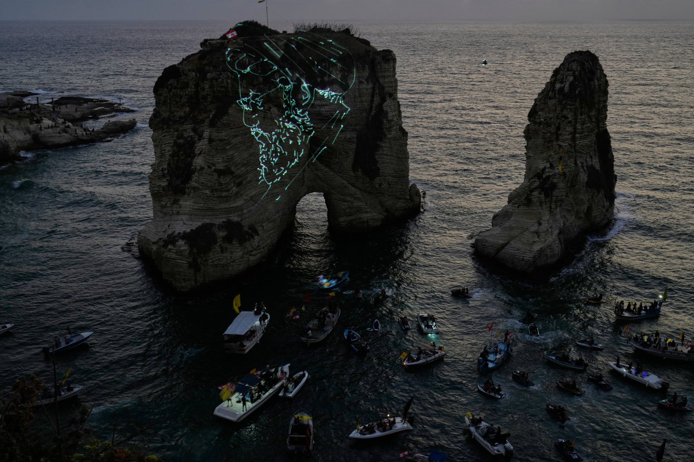 Hezbollah defies Lebanon PM's ban to honor fallen leaders with coastal light show | iNFOnews.ca