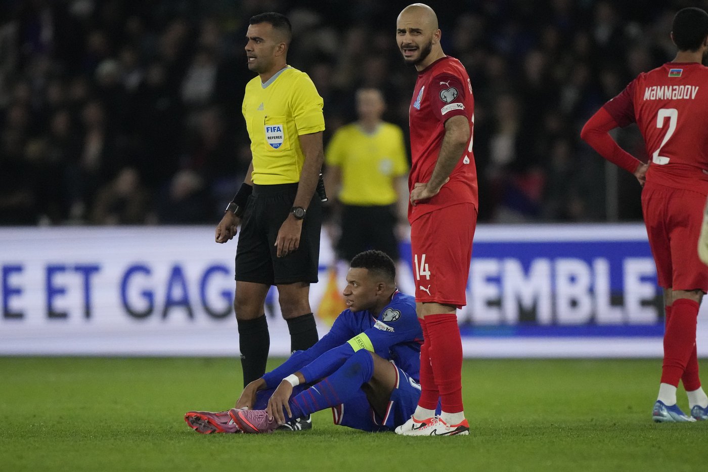 Mbappé scores but limps off late in France's World Cup qualifying win. Germany gets boost | iNFOnews.ca Mbappé scores but limps off late in France's World Cup qualifying win. Germany gets boost | iNFOnews.ca