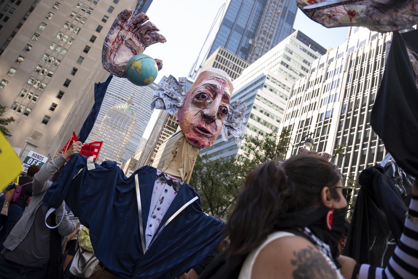 Photos show activists targeting billionaires in a street protest on the eve of New York Climate Week | iNFOnews.ca