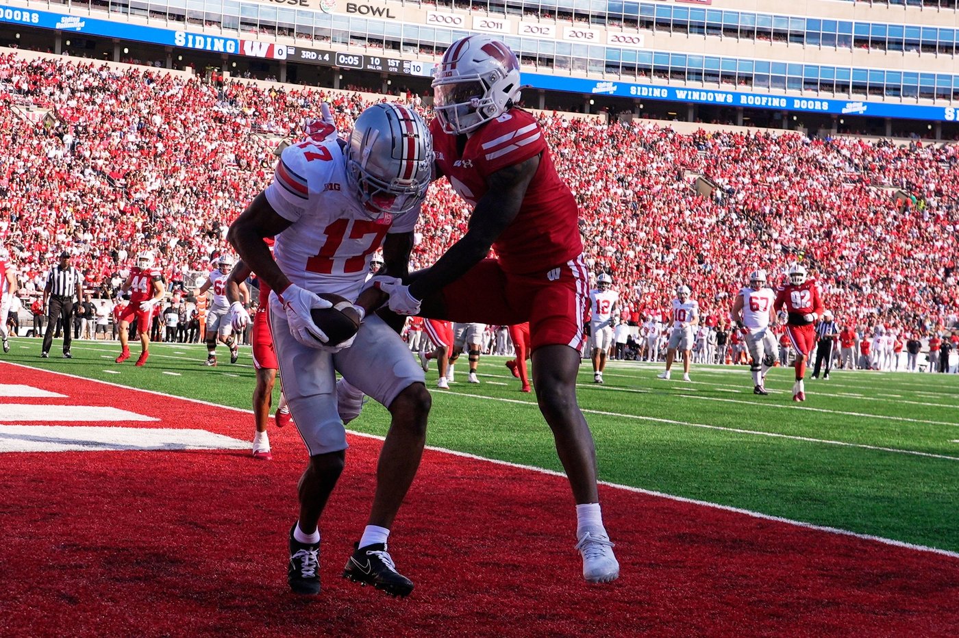 Sayin throws 4 TD passes as No. 1 Ohio State throttles Wisconsin 34-0 | iNFOnews.ca Sayin throws 4 TD passes as No. 1 Ohio State throttles Wisconsin 34-0 | iNFOnews.ca