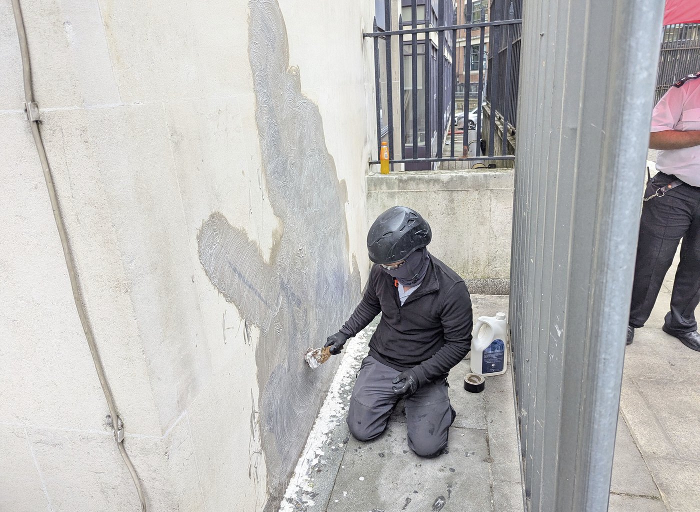 Banksy mural of a judge beating a protester is scrubbed from London court | iNFOnews.ca Banksy mural of a judge beating a protester is scrubbed from London court | iNFOnews.ca