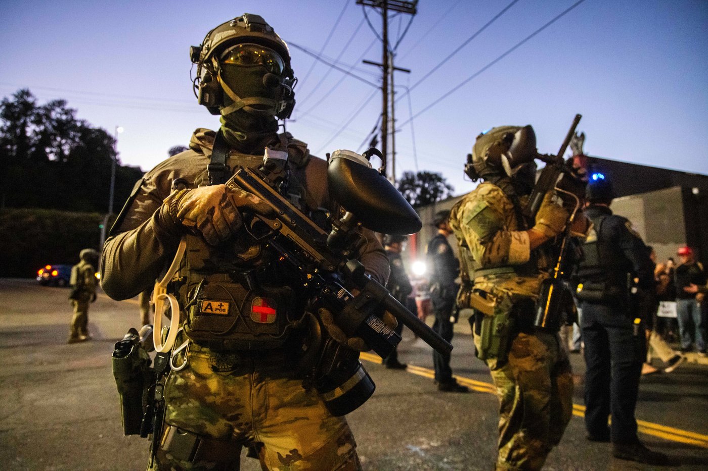 Photos of the mixed reactions to Trump's bid to deploy troops to more US cities | iNFOnews.ca
