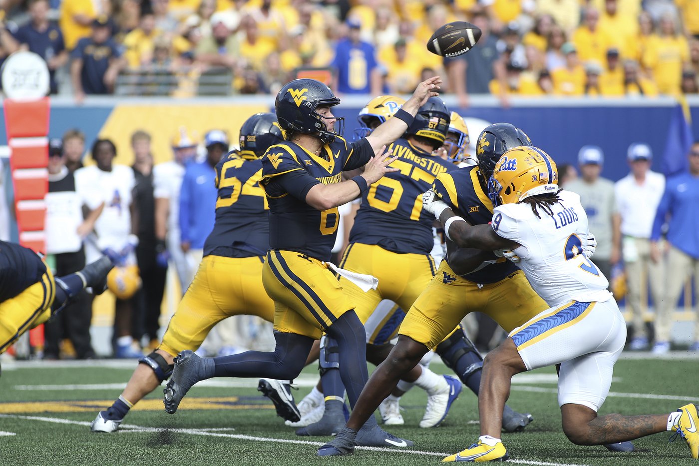 Edwards' short TD run in overtime leads West Virginia over Pittsburgh 31-24 in the Backyard Brawl | iNFOnews.ca