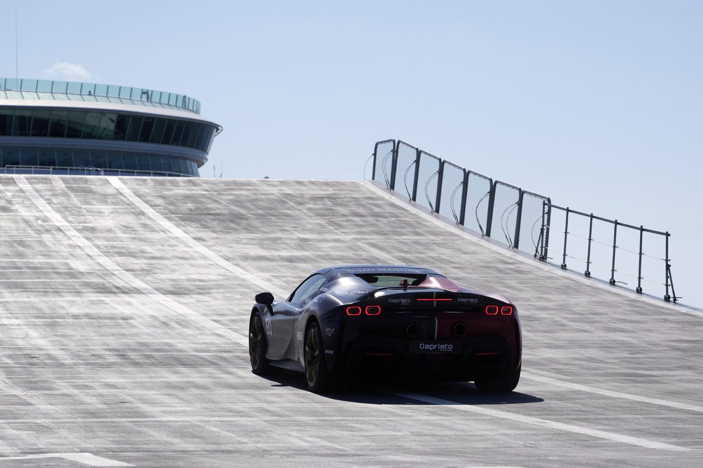 One man in an Italian supercar atop an aircraft carrier. And a record in his sights | iNFOnews.ca