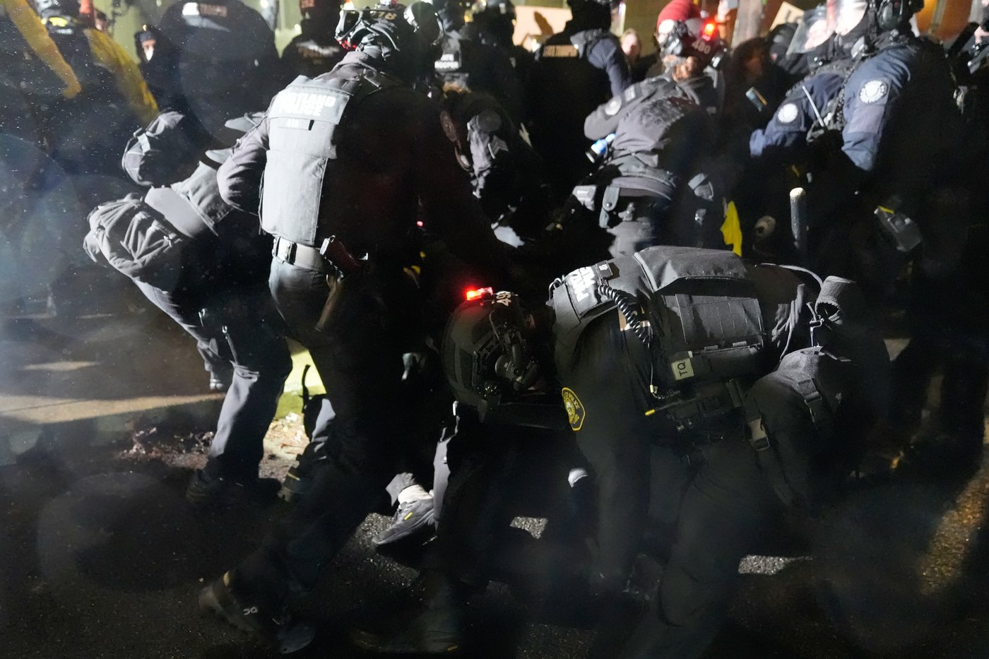 Photos show protests over the shooting of 2 people by federal immigration agents in Oregon | iNFOnews.ca