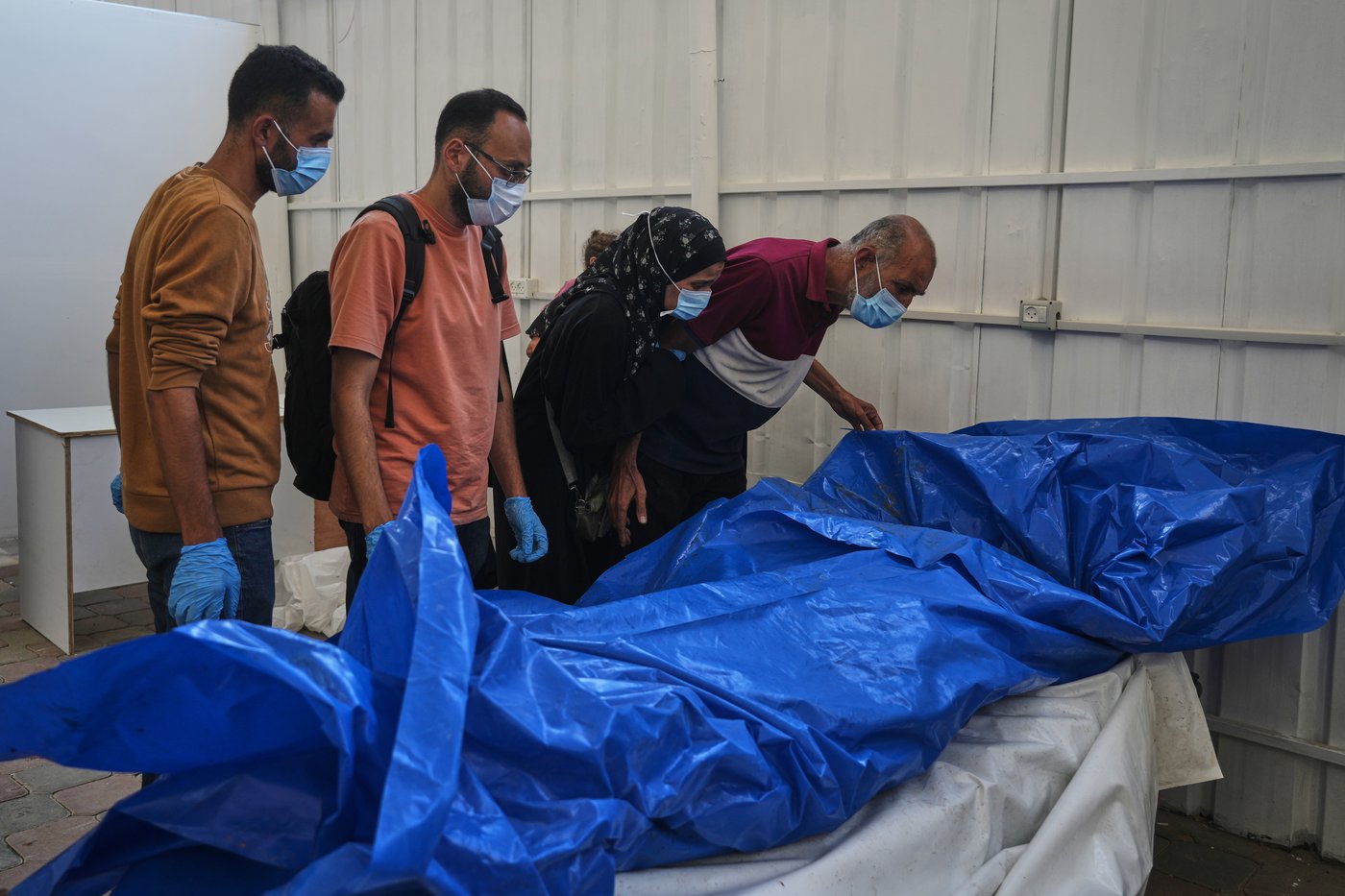 As Israel returns bodies, Palestinians face a grisly search through corpses for lost loved ones | iNFOnews.ca