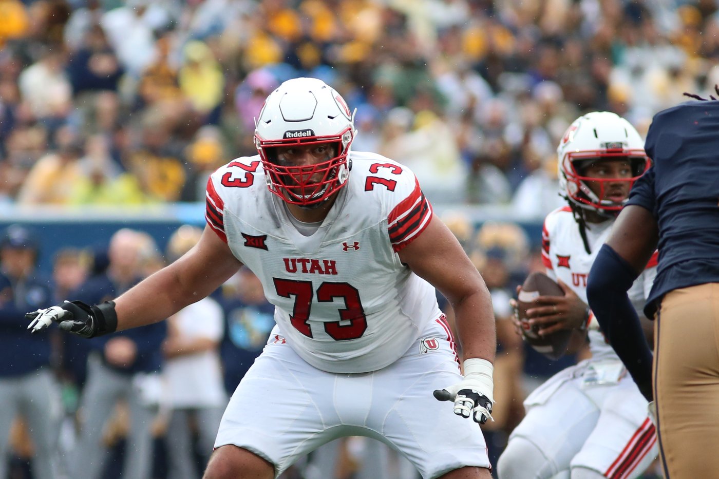 Dampier throws career-high 4 TD passes, runs for a score and Utah beats West Virginia 48-14 | iNFOnews.ca
