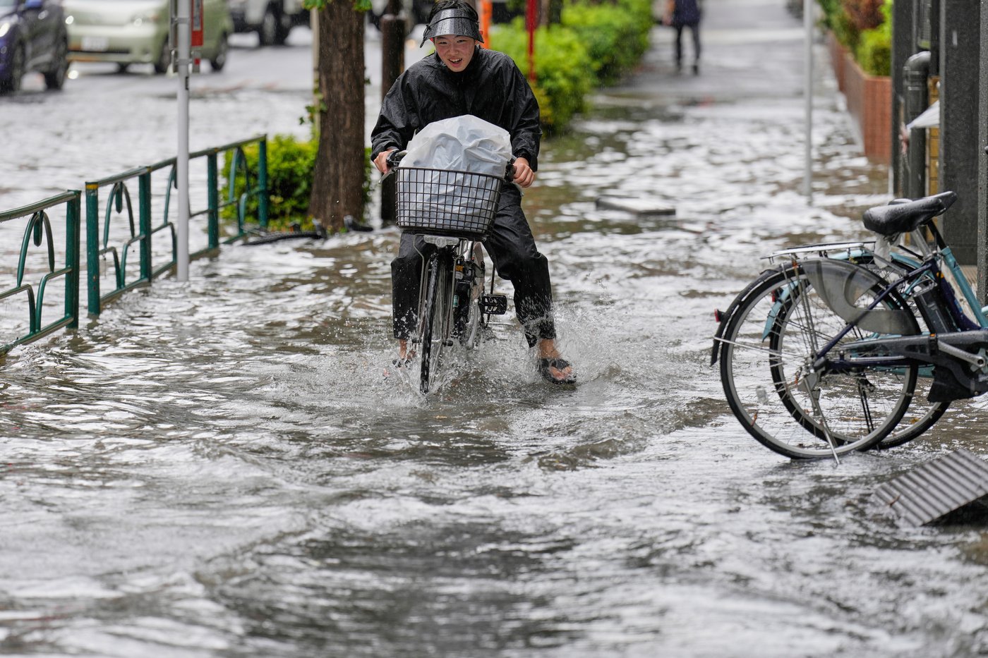 Sudden deluge of rain floods some streets and halts air and rail traffic in Tokyo | iNFOnews.ca