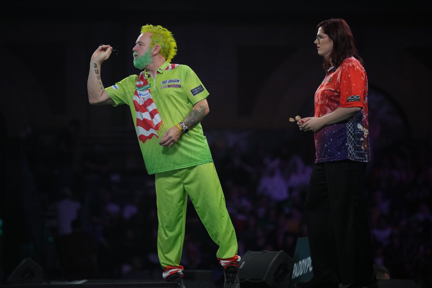 Costumes and competitors light up the World Darts Championships in London, in photos | iNFOnews.ca