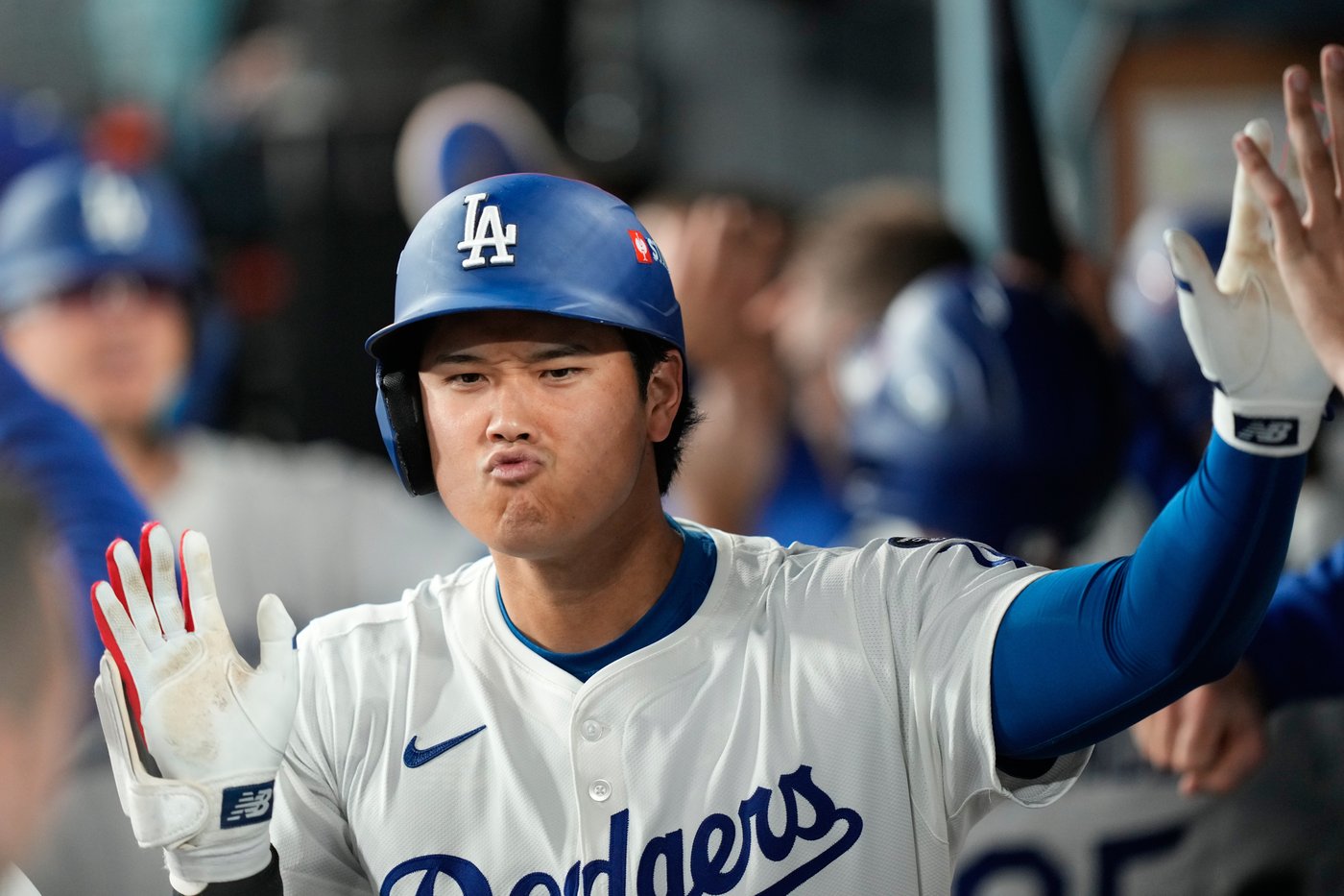 Ohtani hits 2 homers for Dodgers in playoff opener against Reds | iNFOnews.ca