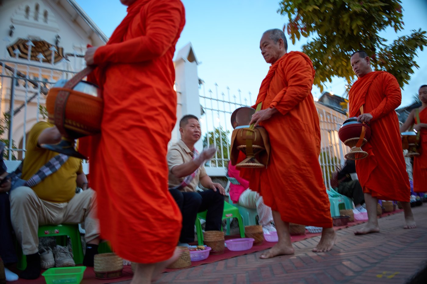 Photos of Buddhist monks in Laos praying in region littered with unexploded bombs | iNFOnews.ca