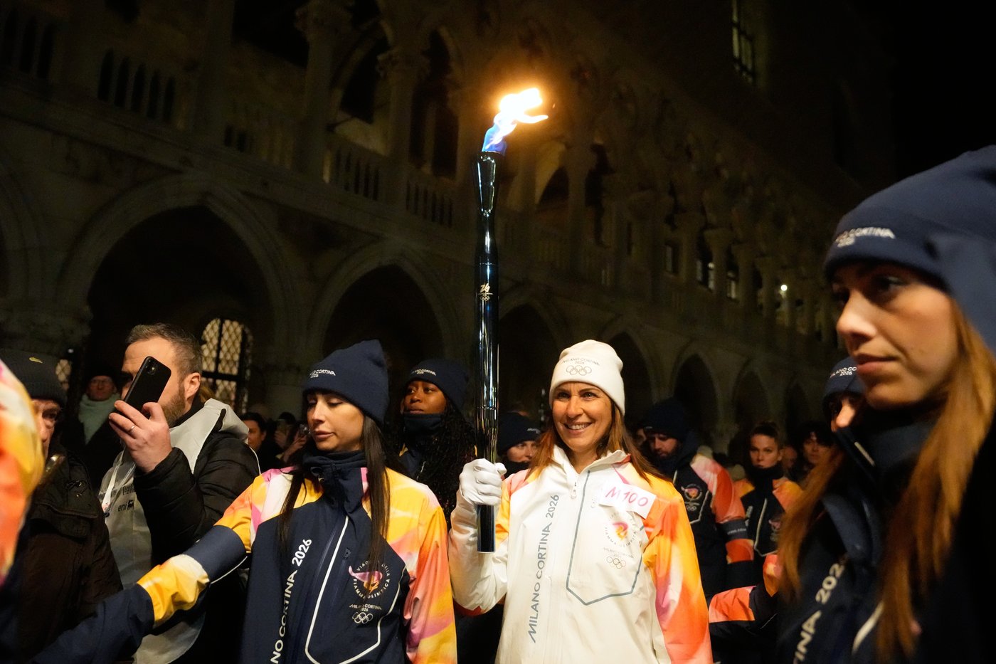 Olympic flame glides on traditional Venetian boats down the Grand Canal | iNFOnews.ca
