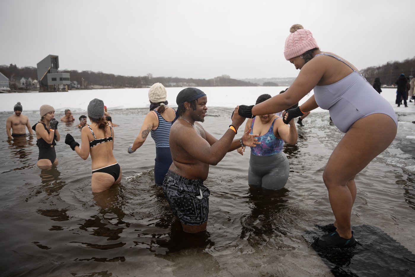 Many mark the new year with 'exhilarating' polar dip in icy water | iNFOnews.ca
