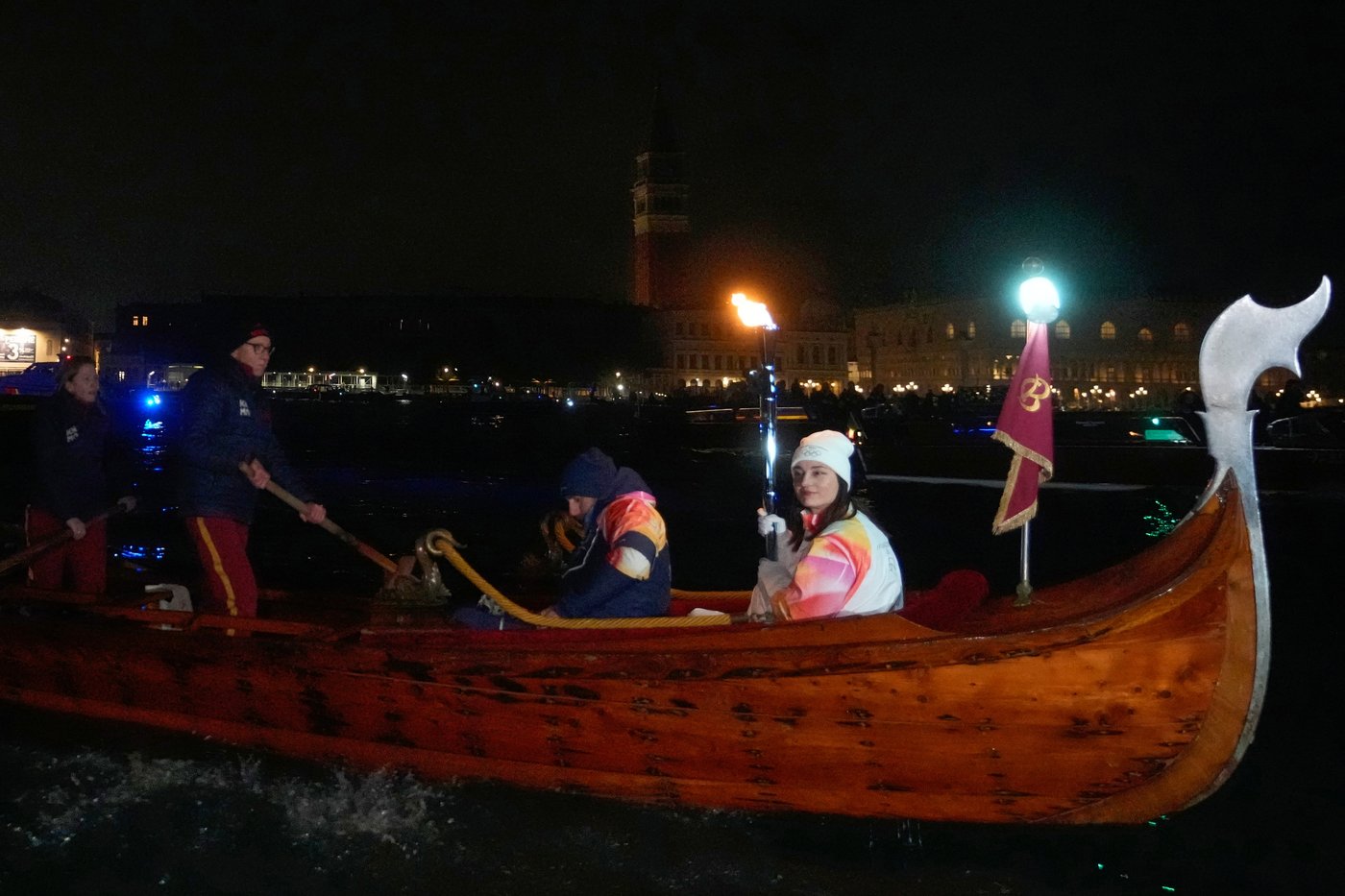Olympic flame glides on traditional Venetian boats down the Grand Canal | iNFOnews.ca